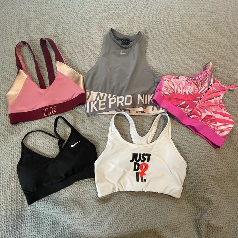 5 Nike Sports Bras- All size M except black bra. Black Bra is a S.
